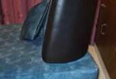 Single sofa with two throw pillows