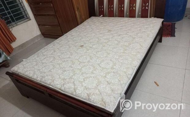 A Regal bed and side drawer