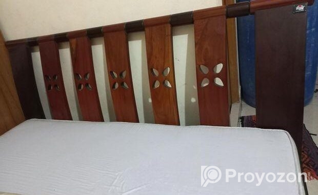 A Regal bed and side drawer