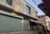 বিগত ছয় মাস পূর্বে নির্মাণাধীন দুইতলা ভবন