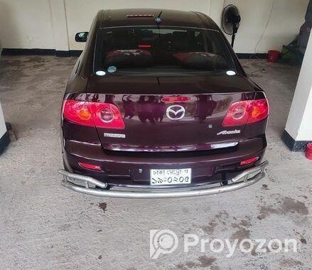 Mazda Axela . 2004