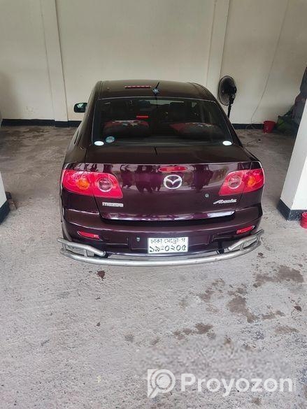 Mazda Axela . 2004