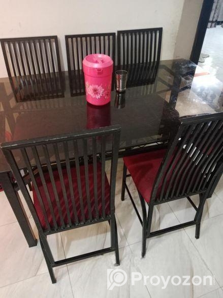 ৬ চেয়ারের পুরাতন লোহার ফ্রেমের উপরে গ্লাসের ডাইনিং টেবিল