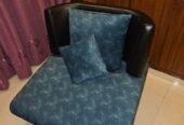 Single sofa with two throw pillows