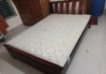 A Regal bed and side drawer