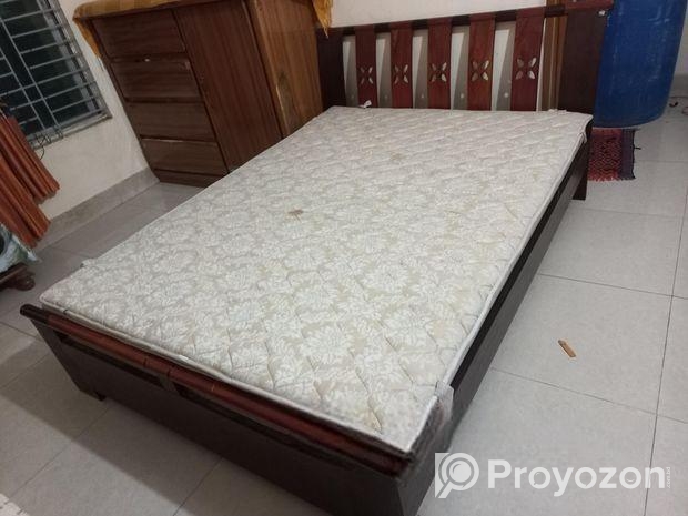 A Regal bed and side drawer