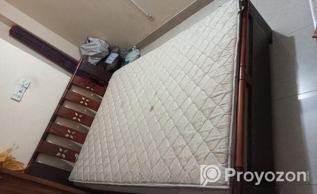 A Regal bed and side drawer