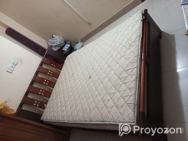 A Regal bed and side drawer