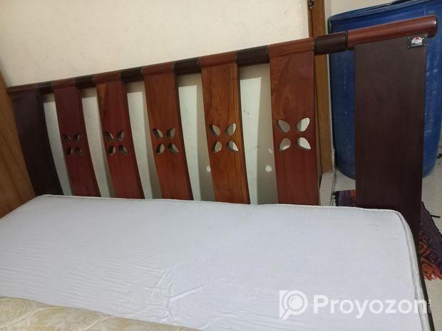 A Regal bed and side drawer