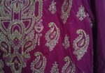 Beautiful purple long dress with intricate golden embroidery