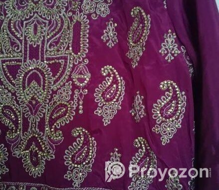 Beautiful purple long dress with intricate golden embroidery