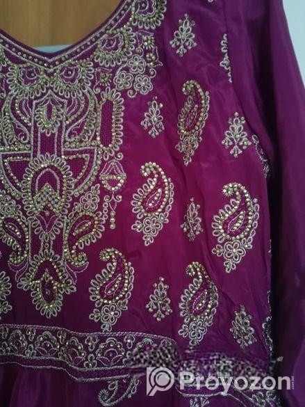 Beautiful purple long dress with intricate golden embroidery